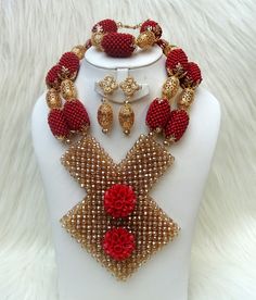 Bold Latest New Design Dark Red & Gold Wedding Bridal African Beads Jewelry Set Complete Set is Necklace Earring and bracelet Wedding Party Bridal Special Occasion This detailed Jewellery set makes you stand out elegantly in any special occassion, it's all about glamour and uniqueness.  Buying more that 1 Jewellery set, we offer wholesale and bulk prices for all our jewellery. Red And Gold Wedding, Red Gold Wedding, Nigerian Beads, Hand Fans For Wedding, Wedding Fans, Gold Feathers, Detailed Jewelry, Beads Jewellery, Elegant Red