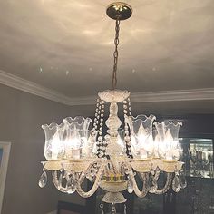 a chandelier hanging from the ceiling in a room