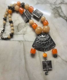 Large Vintage bead India Bedouin style statement necklace.  The clasp is stamped.  Measures: 24" Bohemian Orange Necklaces With Silver Beads, Bedouin Style, Large Beads, Style Statement, Vintage Necklace, Pendant Necklaces, Favorite Jewelry, Jewelry Necklace Pendant, Statement Necklace