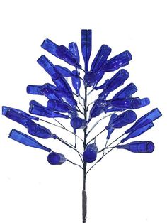 a blue tree made out of glass bottles on a white background with the top half turned upside down