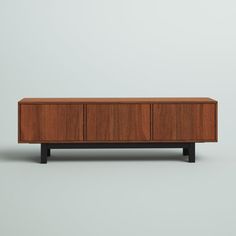 the sideboard is made out of wood and has black legs