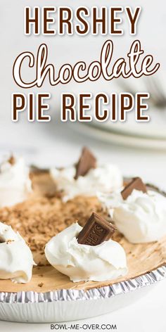 there is a pie with whipped cream and chocolate pieces on top in the pie pan