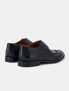 Color: navy Calf leather with natural finish Leather insoles Rubber and leather soles Traditional lace-up closure Hand-stitched detailing Timeless Goodyear Welted Leather Lace-up Shoes, Navy Wingtip Oxfords With Leather Sole, Leather Lace-up Shoes With Stitched Sole For Business Casual, Navy Leather Wingtip Shoes With Leather Sole, Calf Leather Lace-up Dress Shoes With Stitched Sole, Lace-up Leather Shoes With Stitched Sole For Derby, Timeless Leather Lace-up Shoes With Leather Sole, Timeless Lace-up Shoes With Stitched Sole For Work, Lace-up Dress Shoes With Stitched Sole In Calf Leather