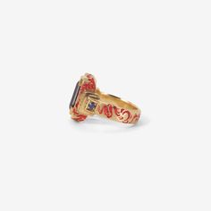 Details Castro Smith 9k yellow gold & iolite Shrine ring with rubies, sapphires & red ceramic plating, size 5 1/4. The iolite measures approximately 3/8″ x 3/16″ & the band measures approximately 1/8" in width. - iolite - ruby - sapphire - 9k yellow gold - red ceramic plating - size 5 1/4 Sizing Due to the nature of this ring it cannot be resized but appropriate sizes can be special ordered. Please inquire to order. Castro Smith Ring, Castro Smith, Bear Face Drawing, Red Ceramic, Shiny Objects, Bear Face, Ruby Sapphire, The Band, Ancient Art