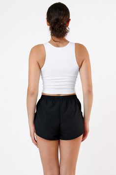 This crop tank is made of a heavy 2x1 rib with spandex so it has a flattering stretch. This textile features more compression than our regular cotton spandex styles and has been garment dyed and washed, so it is shrink-free, in 3 basic colors for your wardrobe. Compared to our regular 100% cotton 2x1 crop tank, this garment is better for working out and has a sexier, tighter fit. Made in Los Angeles, Calif. Our experienced seamstresses earn an average up to $20 an hour or more and no less than $ Workout Seamless Cotton Crop Top, Cotton Seamless Crop Top For Workout, Stretch Cotton Crop Top Sports Bra, Stretch Cotton Sports Crop Top, Casual Compression Tank Top With Built-in Bra, Stretch Cotton Crop Top For Sports, Athleisure Ribbed Crop Tank Top, Athleisure Cotton Tank Crop Top, Cotton Tank Crop Top In Athleisure Style