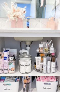 the bathroom cabinet is filled with beauty products