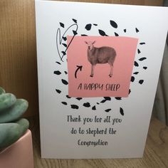 a pink card with a sheep on it