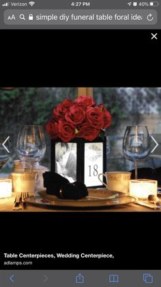 an image of a table setting with candles and red roses on the centerpieces