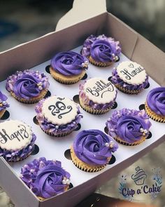 cupcakes with purple frosting in a box that says happy 95th birthday