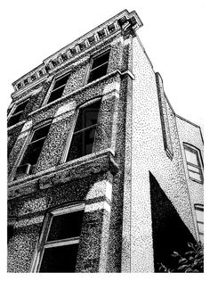 a black and white photo of a building with lots of window panes on it