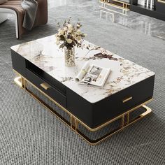 a coffee table with marble top and gold trimmings on the legs in a living room