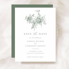 save the date card with greenery and leaves on it in green, white or gray