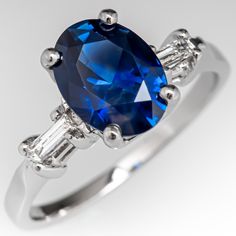 an oval blue sapphire and baguette diamond ring