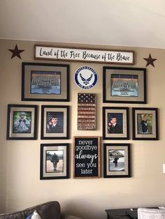 a living room wall with pictures on the wall and an american flag hanging above it