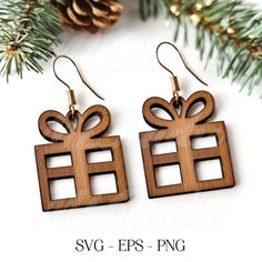 wooden earrings with bows and presents on them