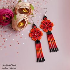 Red orange earrings, Floral huichol earrings, Mexican earrings, Native bead earrings, Beaded flowers, Gift for her, Long tassel earrings. Size: Length, beadwork part - 9.5 cm (3.74'')   Width -3.5 сm (1.38'') Materials: Czech glass beads Stainless steel Nylon Thread .. ready to be given away! Contact me if you have any questions. I will be happy to answer :) Please note that due to lighting effects, monitor's brightness, contrast and other settings, there might be some slight differences in the Beaded Earrings Native White Red Yello Orange, Traditional Orange Beaded Earrings For Gift, Handmade Traditional Orange Beaded Earrings, Handwoven Orange Beaded Earrings For Gift, Handwoven Orange Beaded Earrings As Gift, Beaded Earrings Native Beadwork, Huichol Earrings, Blue Beaded Earrings, Earrings Boho Chic