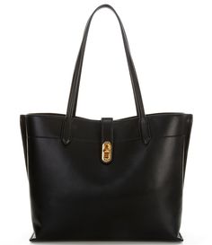 From Donna Karan&#x2C; the Bridgehampton Tote Bag features:Soft leather Bridge Closure with Magnetic SnapInterior pockets: 1 center zip pocket&#x2C; 2 open side pockets&#x2C; 1 interior zip pocket&#x2C; 3 interior slip pocketLined: Genuine leatherStrap: Approx. 10.5" handle dropApprox. 16"W x 11"H x 6"DImported. Daily Use Tote Bag With Gold-tone Hardware, Gold-tone Hardware Tote Bag For On-the-go, Designer Tote Bag With Gold-tone Hardware, Black Hobo Tote Bag With Gold-tone Hardware, Black Tote Box Bag With Gold-tone Hardware, Tailored Jacket, Black Car, Donna Karan, Dillard's