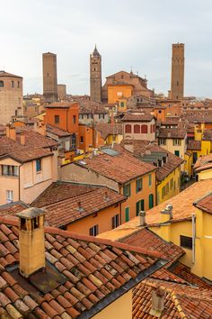 an aerial view of the city with rooftops and tall buildings