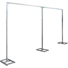 three metal poles with two stands on each side