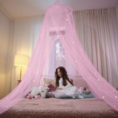 PRICES MAY VARY. CANOPY FIT FOR A PRINCESS: With 46 medium and 23 large glow-in-the-dark stars sprinkled across a pretty, pink mesh netting, this beautiful, magical canopy will truly make any little girl in your life feel like a real princess! The stars—which are made of eco-friendly materials and use advanced adhesive technology to adhere to the net—glisten and glow for a whimsical bed time experience every night. SAFE, FUNCTIONAL, VERSATILE: 100% polyester (a flame-retardant material) with 156 Canopy For Bed, Pink Bed Canopy, Pink Princess Room, Princess Room Decor, Princess Canopy, Canopy Bed Curtains, Bedroom 2024, Pink Bed, Dark Stars