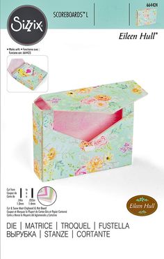 an open box with flowers on it and the lid is pink, yellow and green