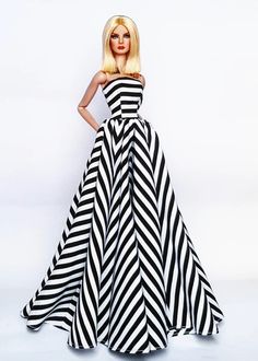 a barbie doll wearing a black and white striped dress