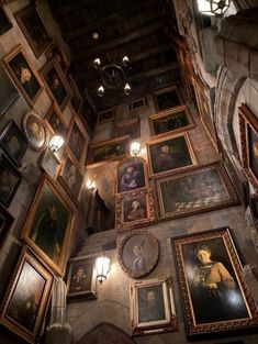 the ceiling is covered with paintings and lights