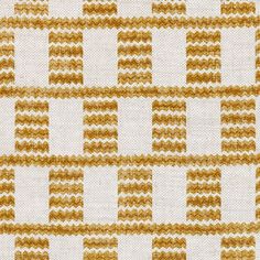 an orange and white checkered pattern on fabric