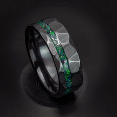 This sleek black ceramic ring has real meteorite shavings mixed with Black Emerald Lab opal! The meteorite in this ring has shavings collected from making meteorite rings, the meteorites are found in the Muonionalusta Meteorite field in Sweden. Black Ceramic is a great choice for a ring because it is incredibly hard, so hard that it takes a diamond to scratch it! The material is also black all the way through, which is much better than most tungsten coated rings because the black will never come Meteorite Rings, Red Opal, Emerald Rings, Meteorite Ring, Ceramic Ring, Unique Gifts For Men, Mens Engagement, Ceramic Rings, Green Copper