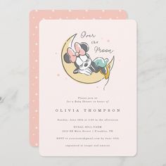 a pink and white baby shower with minnie mouse on the moon