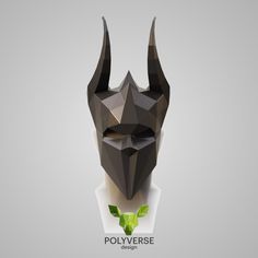 an abstract polygonal mask with horns and leaves