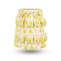 a yellow cloth diaper with smiley faces on the front and bottom, sitting in front of a white background