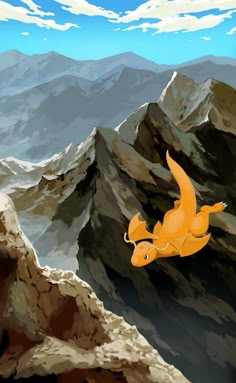 an orange bird flying over the top of a mountain