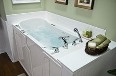 a bathroom with a large jacuzzi tub in it