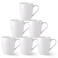 six white coffee mugs stacked on top of each other