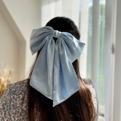 Large and luxurious light sky blue satin with crushed effect hair bow for girls They are handmade with love and care using high quality fabric.  📏The bow measures  25 cm in width 12 cm in height  Tail is 23 cm long  📍Attachment: Barrette (Available in other attachments. Please message me)  *Please be noted that the color might appear a little differently on each phone, tablet, or computer screen. Spring Editorial, Large Hair Bow, Giant Bow, Blue Hair Bows, Large Hair Bows, Bow Hairstyle, Hair Ribbon, Christmas Gifts For Girls, Big Bow