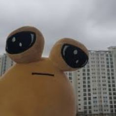 an inflatable toy with two eyes on it's head and one eye open