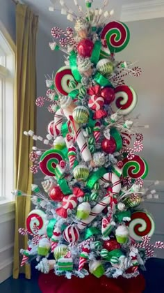 a christmas tree decorated with candy canes and candies