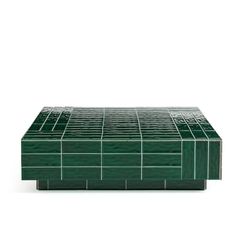 a green table with square tiles on it