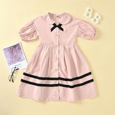 Girls Bow Decor Short Sleeve Striped Button Dress Girls Boutique Clothes Wholesale - PrettyKid Spring School Dress With Peter Pan Collar, Summer Doll Collar Dress With Buttons, Cute Pink School Dress, Preppy Pink School Dress, Cute Short Sleeve Dress With Button Closure, Cute Pink Dresses With Buttons, Cute Pink Dress With Buttons, Casual School Dress With Buttons, Casual Buttoned School Dress