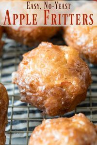 several donuts are cooling on a wire rack