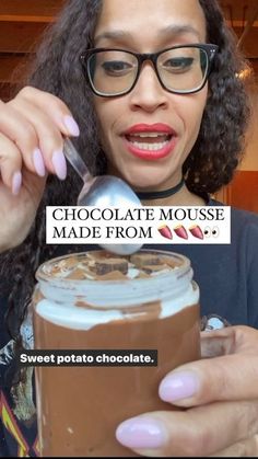 a woman holding a spoon in front of a jar of chocolate mousse with the caption sweet potato chocolate