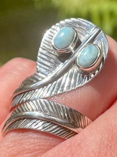 Larimar Feather Ring Emotional Healing Larimar can soothe and heal your emotions while relieving stress. It can assist with clear communication. This stone will help you to release deep-seated pain that you have been holding onto. It is useful to attract blessings and positive energy to you. Larimar can also help to remove energy blockages that are affecting you physically and emotionally. Sterling Silver Ring is a Size 8. Spiritual Turquoise Healing Ring, Spiritual Healing Turquoise Ring, Feather Ring, Clear Communication, Emotional Healing, Positive Energy, Sterling Silver Ring, Sterling Silver Rings, Silver Ring