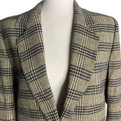 Vintage 70s Wool Blazer Jacket 10 Black Tan Plaid Lined Notch Collar ButtonExcellent conditionNo fabric tags, feels like a wool blendChest: 19" laying flatSleeves: 21"Length: 27" shoulder to hem Wool Career Blazer With Button Closure, Retro Notch Lapel Blazer For Fall, Retro Button-up Fall Blazer, Classic Wool Blazer With Snap Buttons, Retro Tailored Long Sleeve Blazer, Retro Single-breasted Fall Blazer, Retro Single Breasted Long Sleeve Blazer, Retro Single-breasted Blazer For Fall, Retro Single-breasted Long Sleeve Blazer