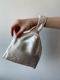 "Pure white natural mulberry silk three pieces silk set:  A silk knot/wrist bag, a skinny scarf & a medium size scrunchie, Color:  white. Knot bag: 12.9\" x 8.7\", made of 100% mulberry silk with cotton lining. Skinny Scarf/Hair Tie : 100 cm x 6.5 cm / 39.5 in x 2.6 in. Scrunchie: 4 inch in diameter. This simple silk bag is soft, lustrous and stylish . It can be used as a white evening bag, a bridal bag or a casual wrist bag in many occasions. It's large enough to carry small personal items such as a mobile phone and a sunglasses. This beautiful set is a great gift idea for special occasions. Care Instruction: Pure silk is a type of natural and organic fabric, please avoid washing too often, avoid soaking in water, gently hand wash cold, natural air dry or lay flat to dry. Stored in a cool Scrunchie Bag, Small Scrunchies, Narrow Scarf, Bridal Bags, Scarf Hair Tie, Scarf Bag, Knot Bag, Wrist Bag, Silk Scrunchies