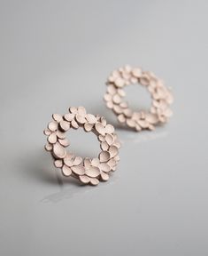 Silver and rose gold plated halo Earrings from my Floral wreath collection. Approx. 1.5cm dia. Rose Gold Round Flower Earrings For Anniversary, Rose Gold Hoop Earrings With Halo Design For Gift, Rose Gold Halo Design Hoop Earrings For Gift, Rose Gold Sterling Silver Cluster Earrings, Delicate Rose Gold Round Flower Earrings, Rose Gold Circle Sterling Silver Earrings, Rose Gold Sterling Silver Circle Earrings, Elegant Rose Gold Circle Earrings, Rose Gold Round Cluster Earrings Gift