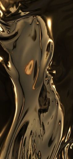 an abstract image of gold and black liquid