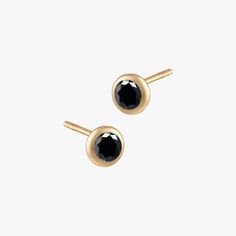 Designed to subtly show off your school spirit, the Bezel Gemstone Studs are the perfect addition to your ear stack. Pick a single color, or mix and match to elevate your game day with your team’s colors. BLACK ONYX: PROTECTION. RELEASE. CALM Made in solid material set with round brilliant cut Black Onyx (AA grade) Conflict-free and socially responsible Black Onyx only Available in Sterling Silver and Cavan Gold Total Diameter 5MM, Stone Diameter 4MM Sold as Pair Only Black Earring Curation, Classic Round Onyx Earrings, Luxury Classic Onyx Earrings, Black Onyx Round Earrings, Luxury Black Onyx Earrings, Nickel-free Black Onyx Earrings, Black Stud, Ear Stack, Gemstone Studs