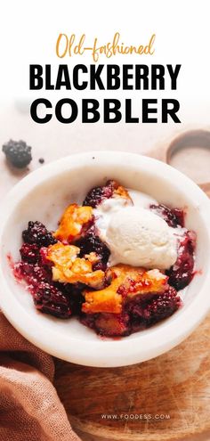 a bowl filled with berries and ice cream on top of a wooden cutting board next to a