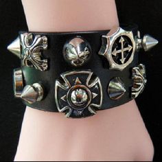 This stylish punk gothic cuff bracelet comes with studs for a cool look and has two circumference positions: 6.5" and 7.5" to fit most wrists (16-19 cm). Punk Style Adjustable Cuff Bracelet With Rivets, Punk Adjustable Cuff Bracelet With Rivets, Black Rock Style Wristband As Gift, Adjustable Black Band Punk Cuff Bracelet, Adjustable Punk Cuff Bracelet With Black Band, Adjustable Punk Cuff Bracelet With Rivets, Black Band Wristband For Concerts, Adjustable Black Punk Wristband, Black Punk Bracelets For Festival